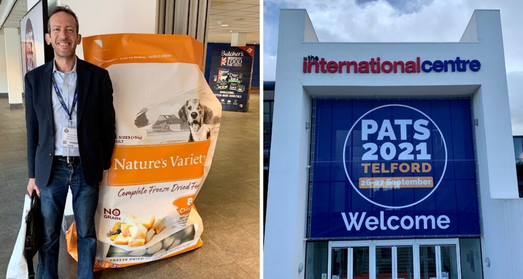 Man next to a big bag of dog food in the international centre